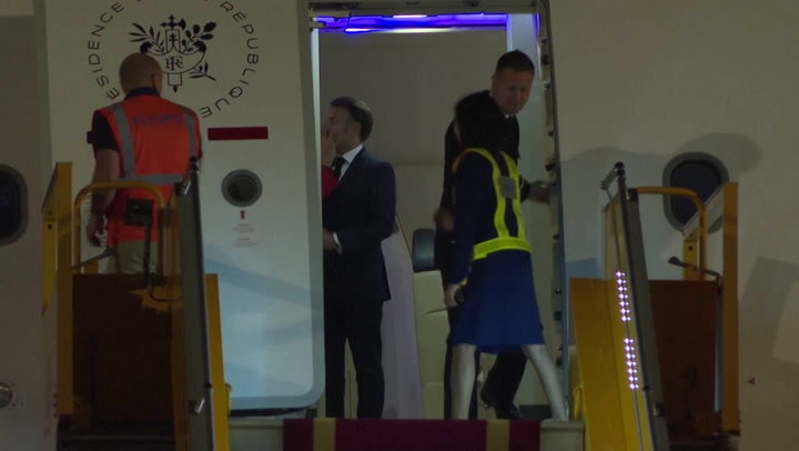 France’s first lady seems to push her husband as they land in Vietnam. He says they were joking 